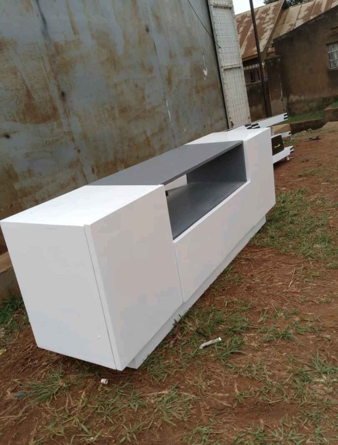 Grey and white TV stand for sale in Kampala - Yilick