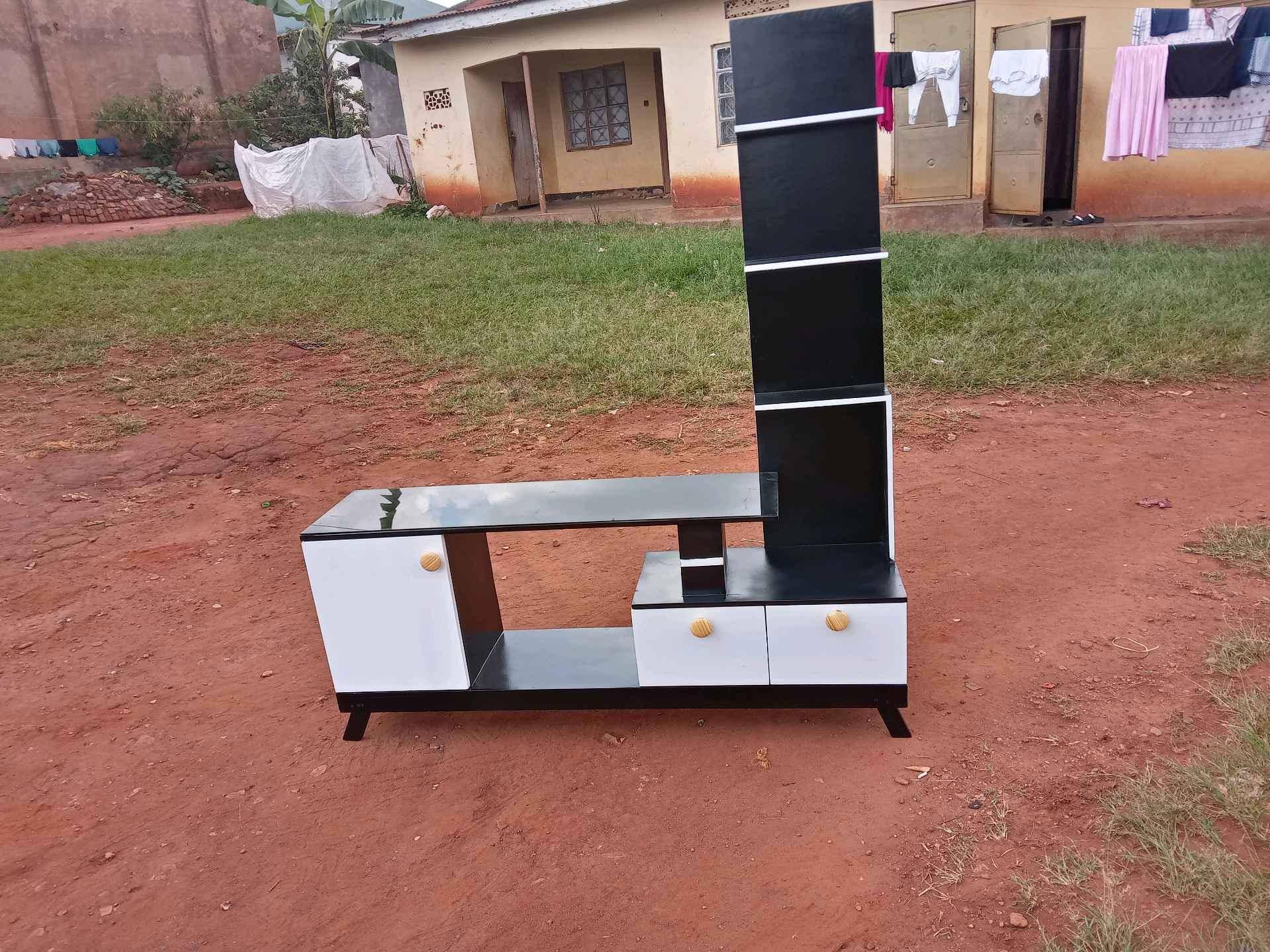 TV stand white and black color for sale in Kampala - Yilick